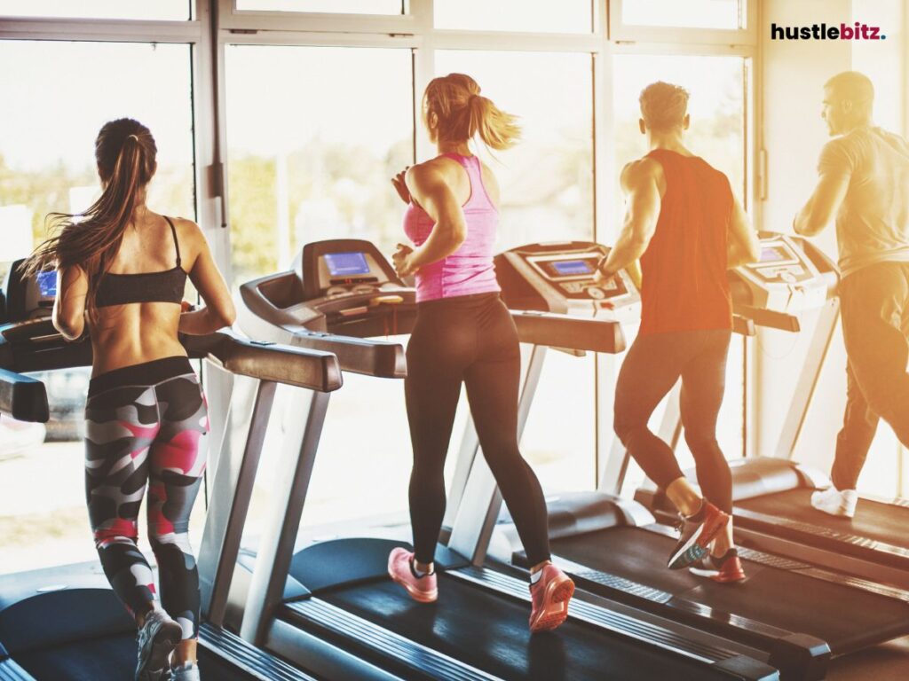 four people doing exercise in the trade mail