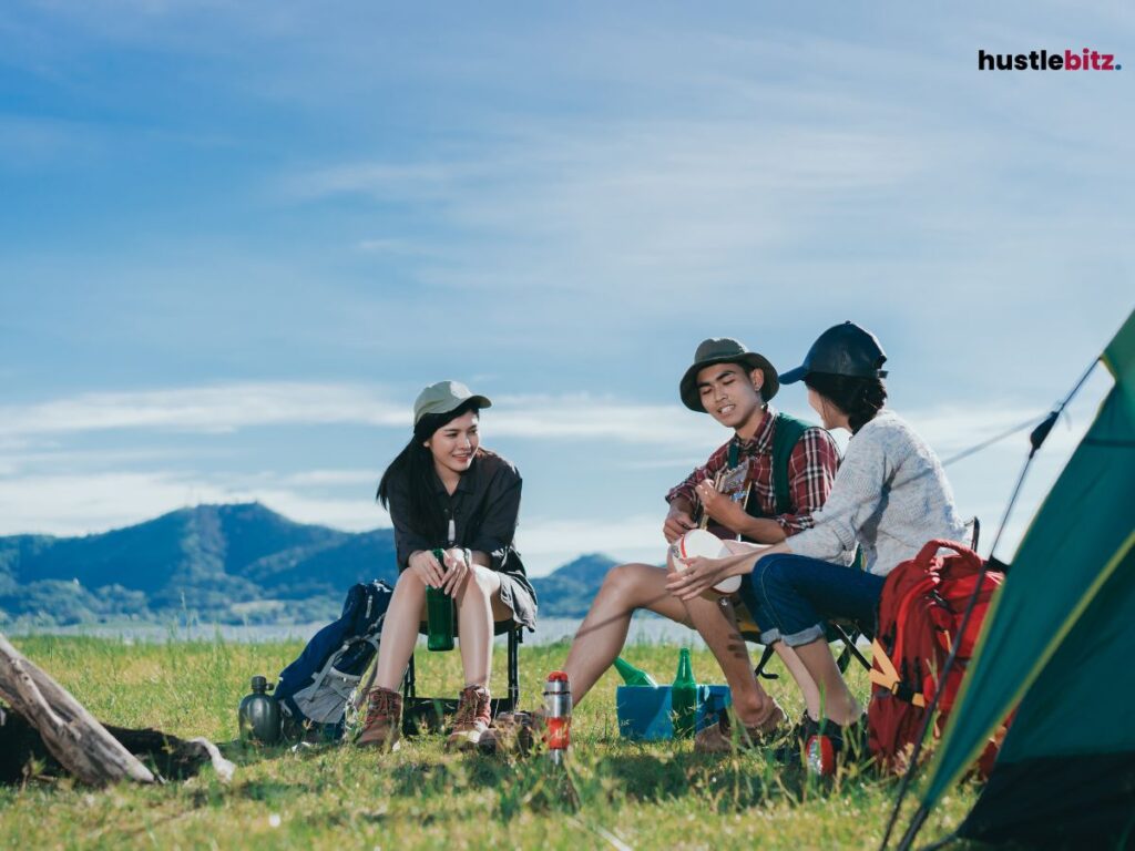 Three people sit and listen to the man singing