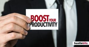 A man holding a card with "Boost Your Productivity" printed on it.