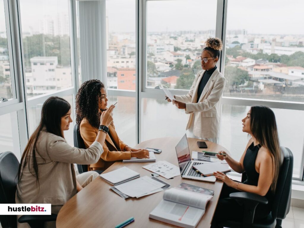 a group of women talking inside the office