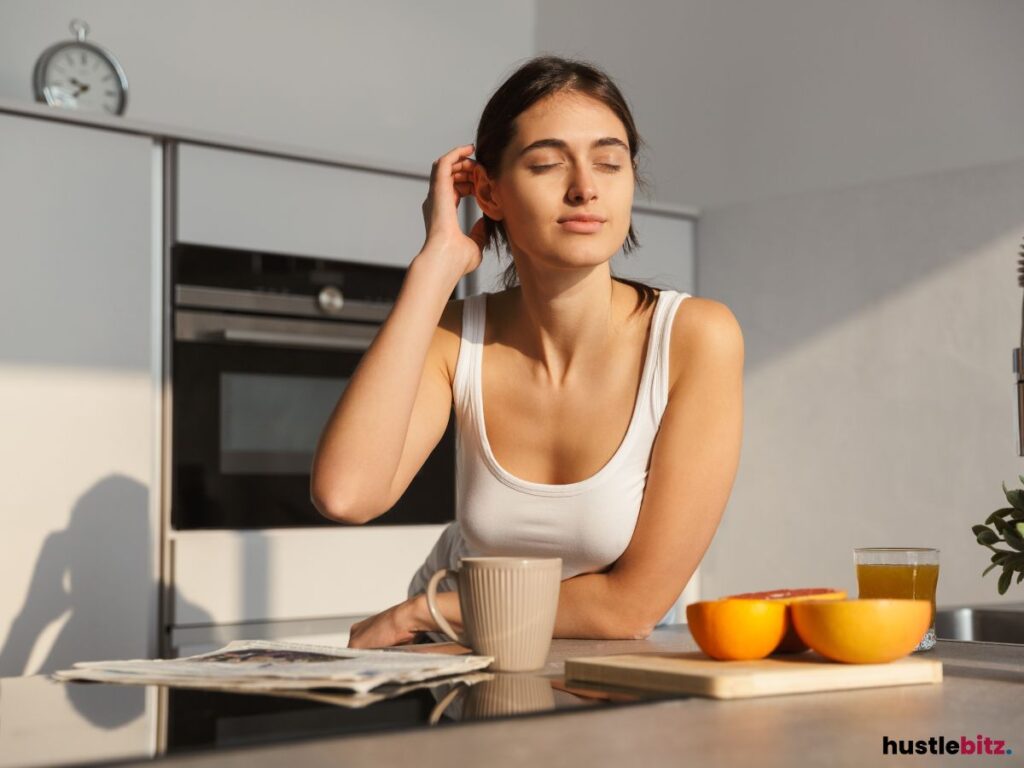 A woman having her morning coffee and feeling the morning sun light.
