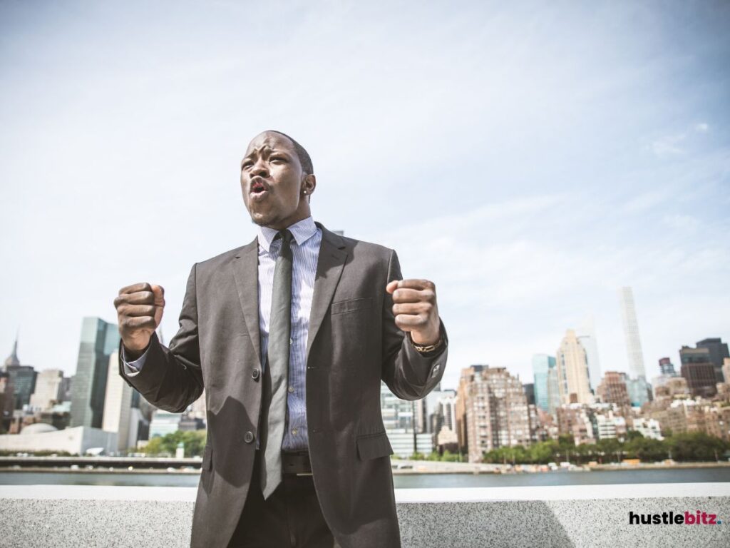 Businessman with his fist expressing an excitement and victory.