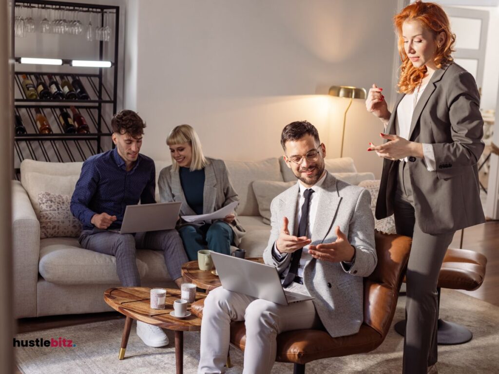 group of people sitting and standing while talking to each other