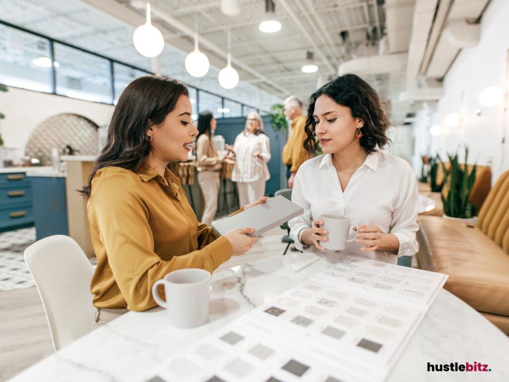 two women talking each other inside the office