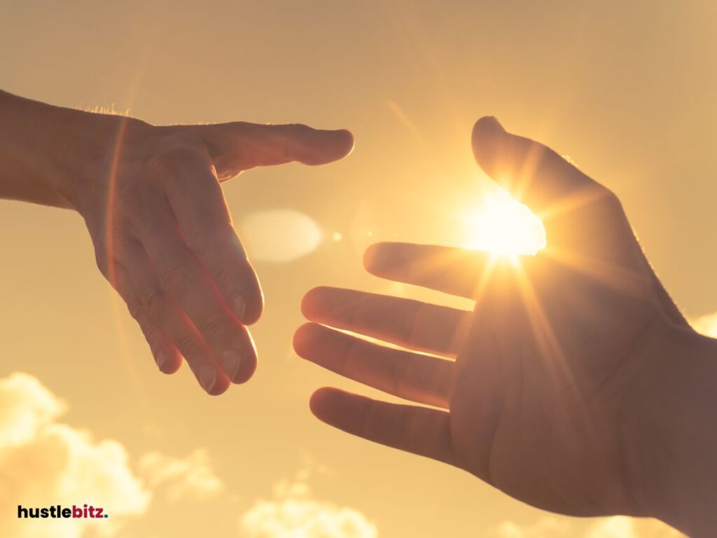 two hand preparing to hold each other and a sunny background