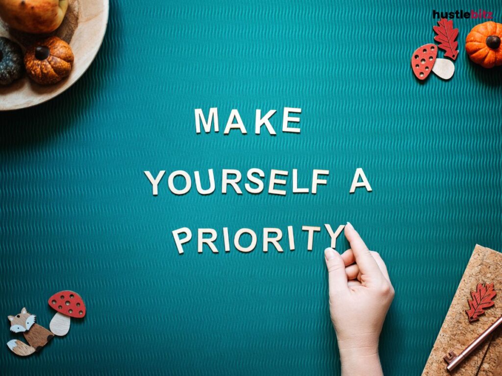 Wooden letters spelling "Make Yourself a Priority" on a textured green background.