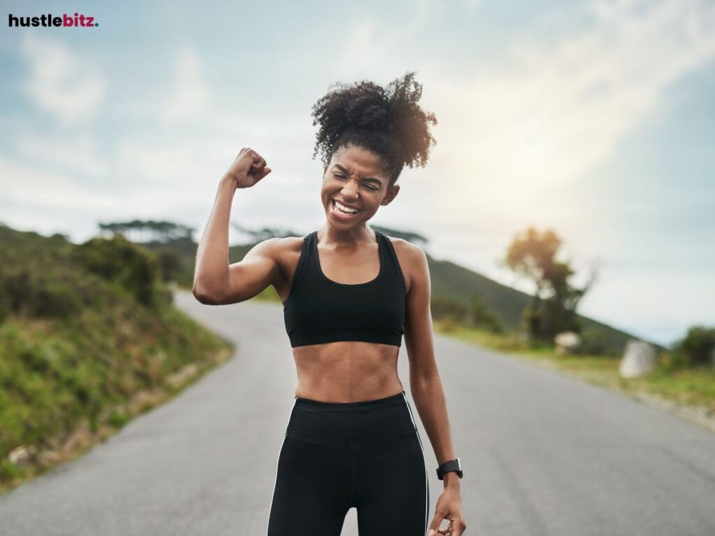 A woman raising her fist showing the expression of victory.