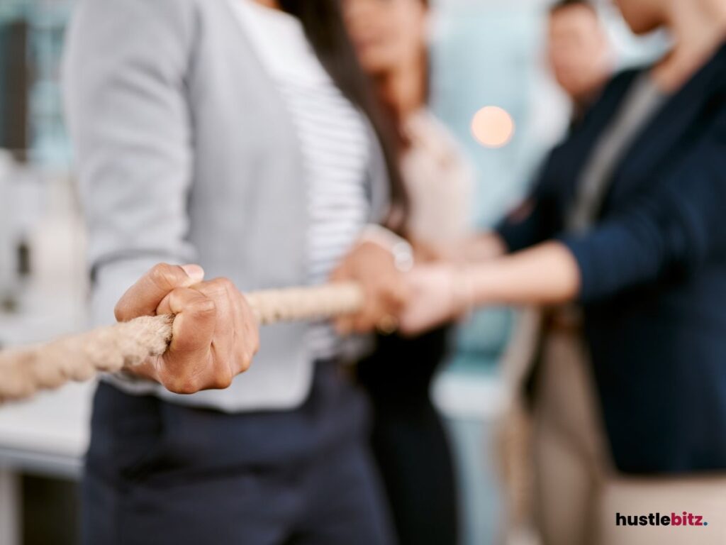 A team engages in a tug-of-war.