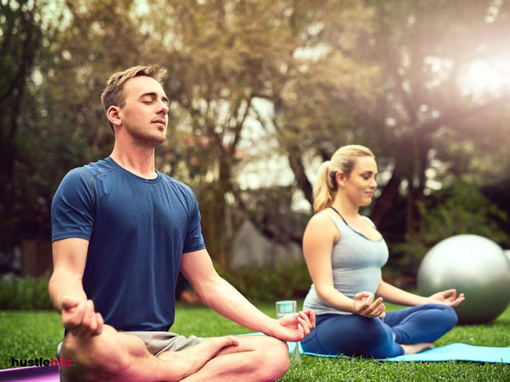 a woman and a man doing meditation