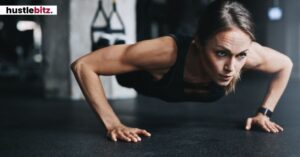 A woman doing a push-up, focused and determined.