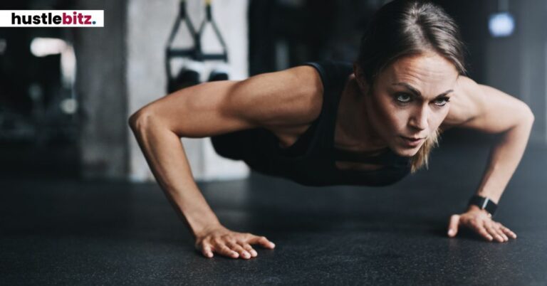 A woman doing a push-up, focused and determined.