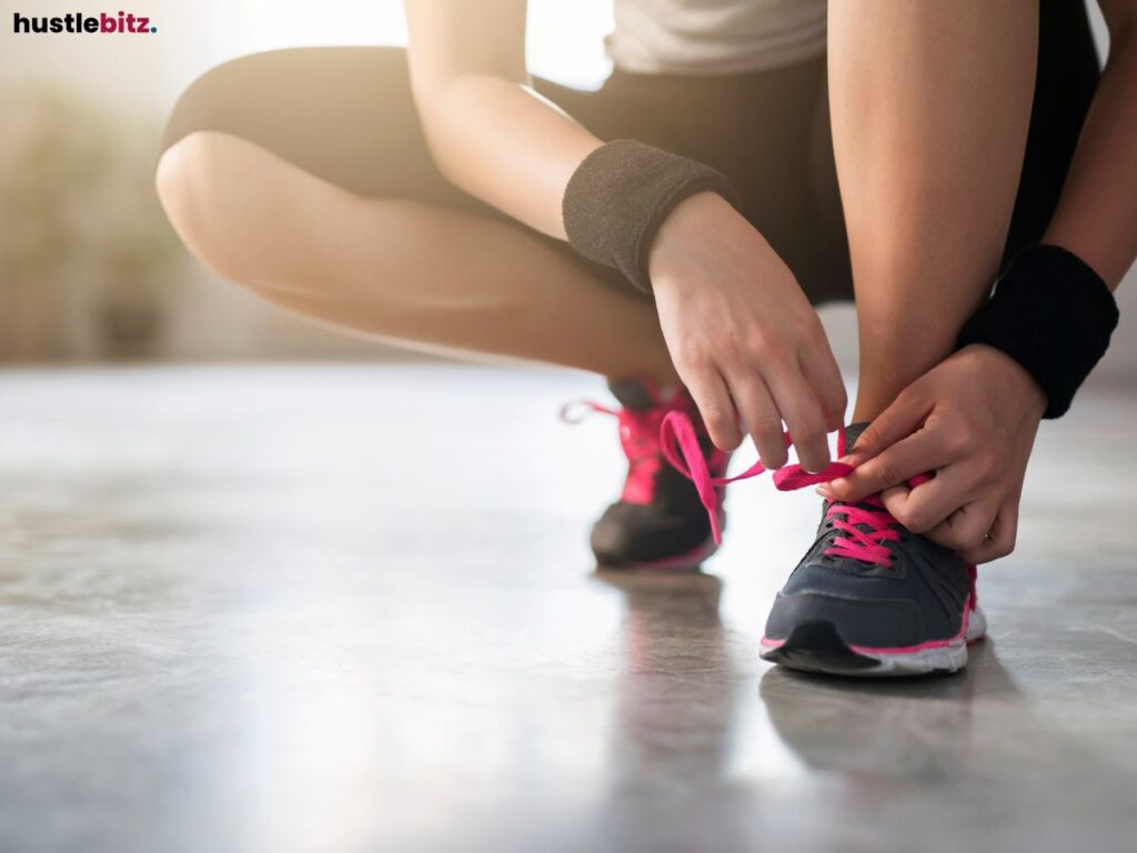 A close-up shot of a person tying shoelaces.