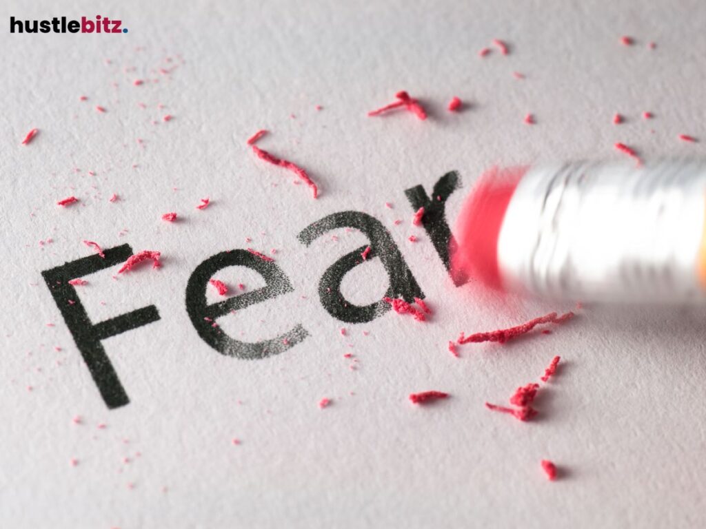 An eraser rubbing off the word "Fear."