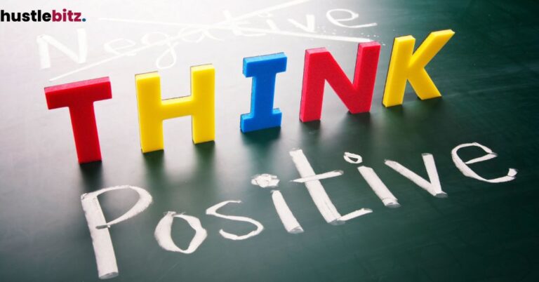 The phrase "Think Positive" with colorful letters, replacing the word "Negative" on a chalkboard.