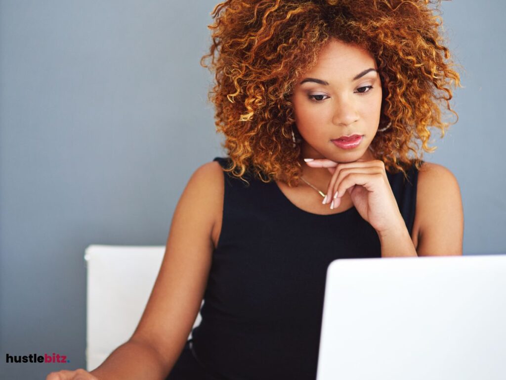 A woman looking at the laptop