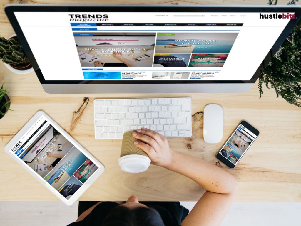 A woman drinking coffee in front of the monitor