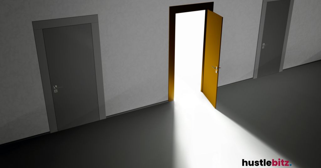 Open door in the middle of other doors that releases light.