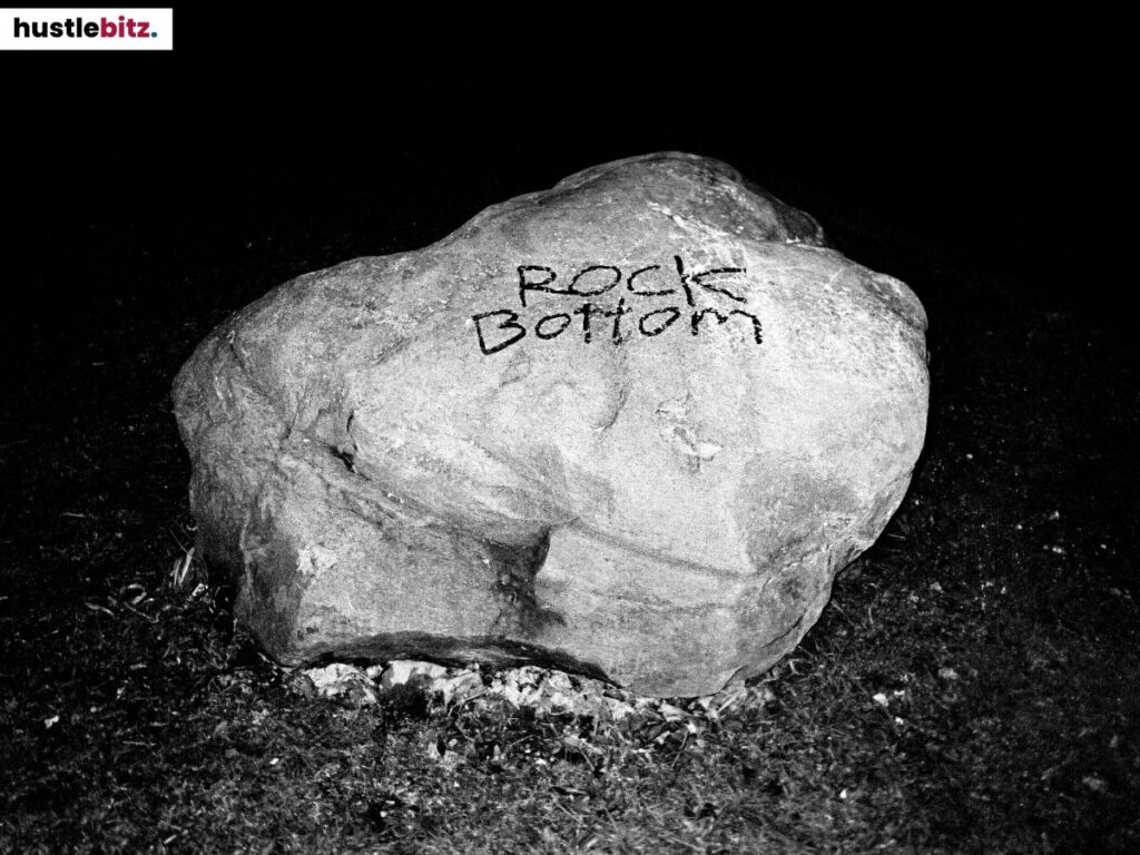 A huge rock with a word "rock Bottom" written.