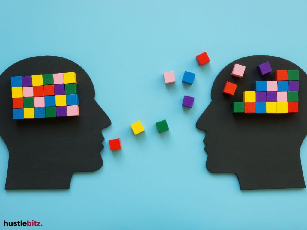 Colorful blocks exchange between two head silhouettes.