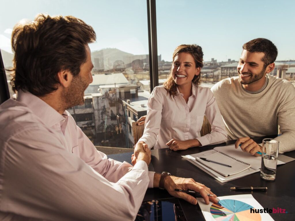 group of people smiles looking each other inside the office