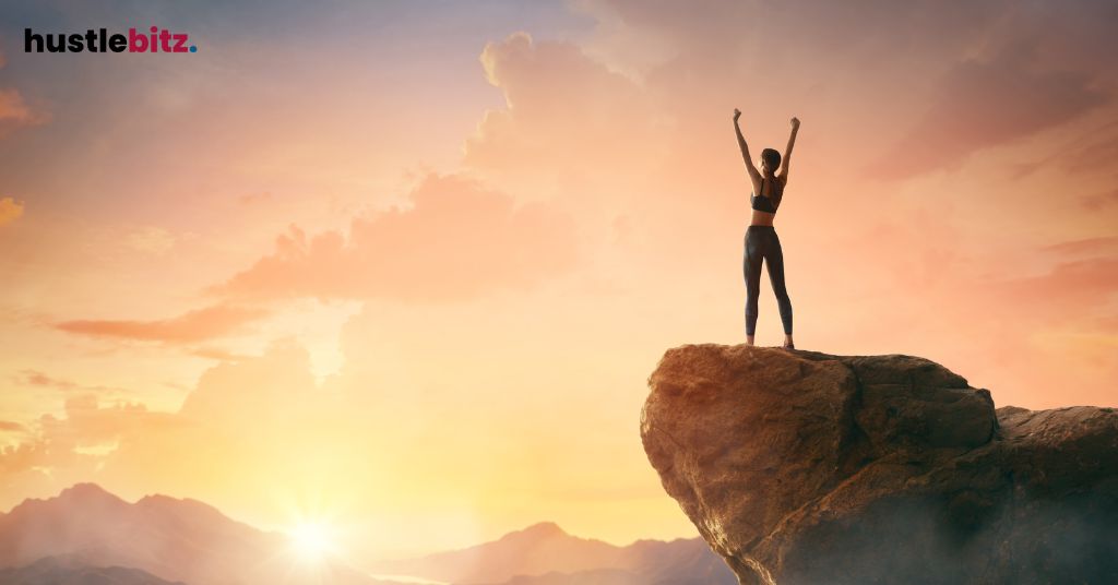 A woman standing and raise her two hands