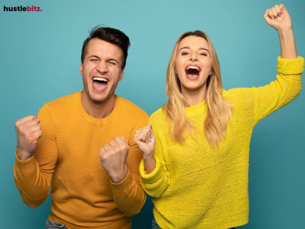 Two people joydully cheering.