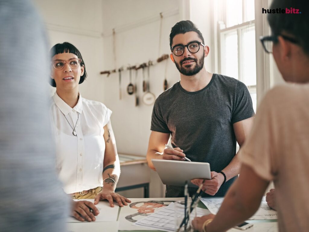 A man and woman looking at the left side of the person talking