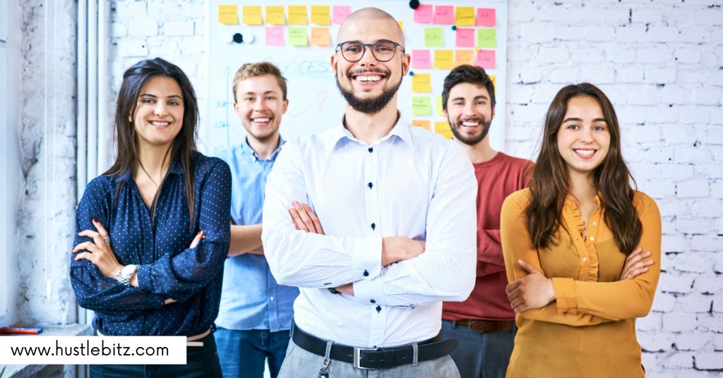 A group of people smiles in front of the camera