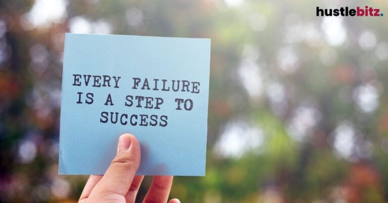 a hand holding a sticky note with motivational quotes