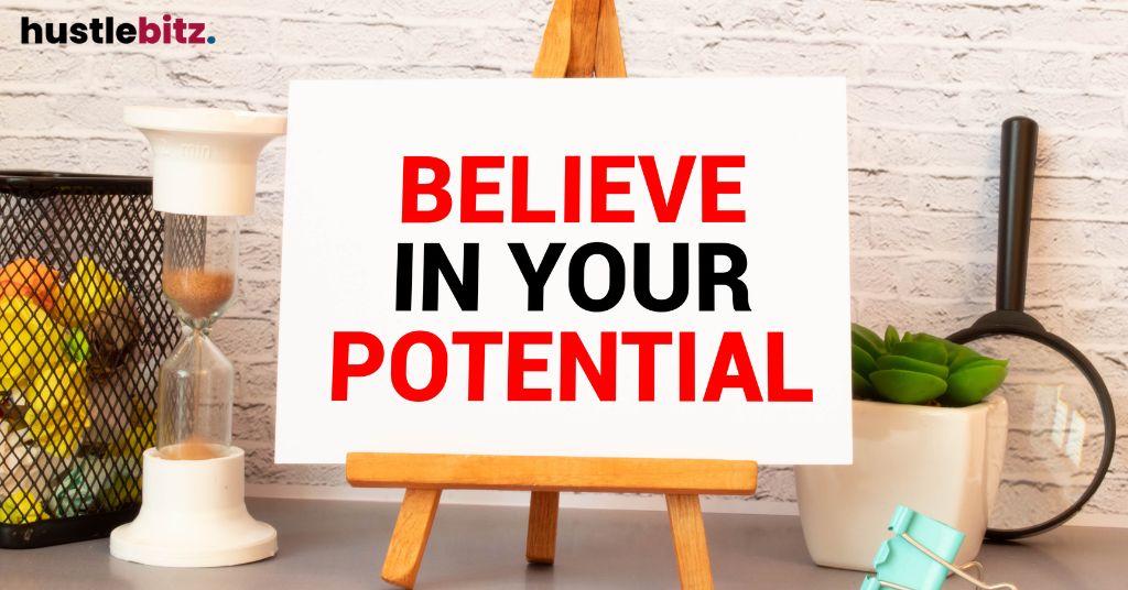A whiteboard reads "BELIEVE IN YOUR POTENTIAL" on a desk.