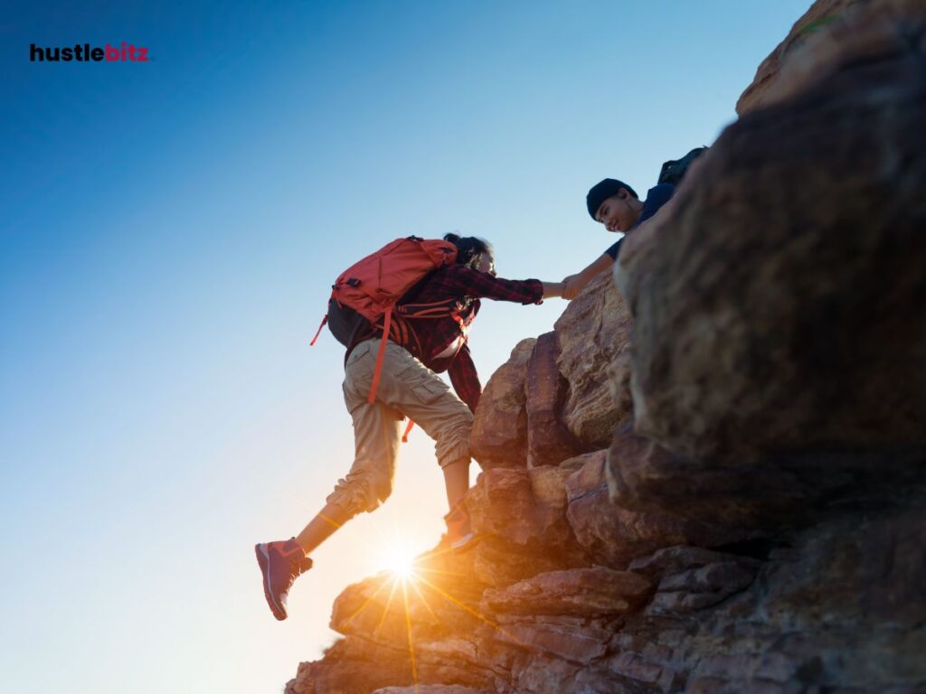 A woman climb the mountain rock