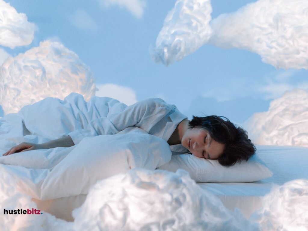 A woman sleeping on a cloud-like bed, surrounded by soft clouds.