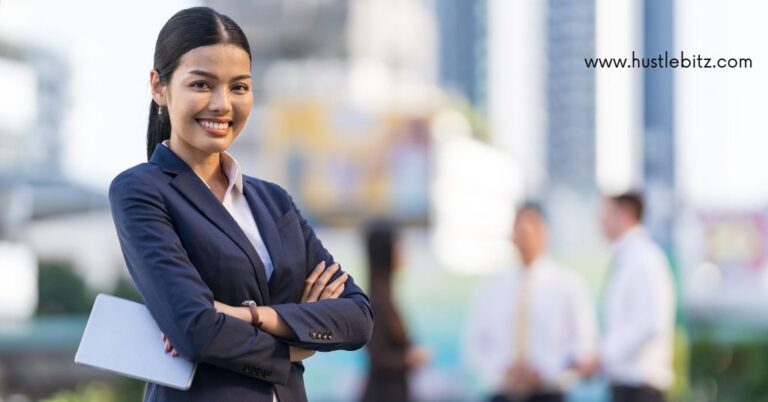 A woan in her business attire smiling.