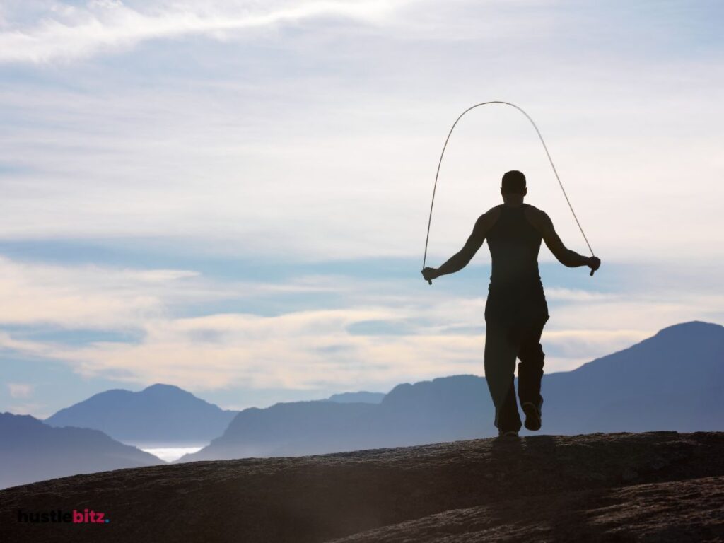 A man doing exercise facing the mountain