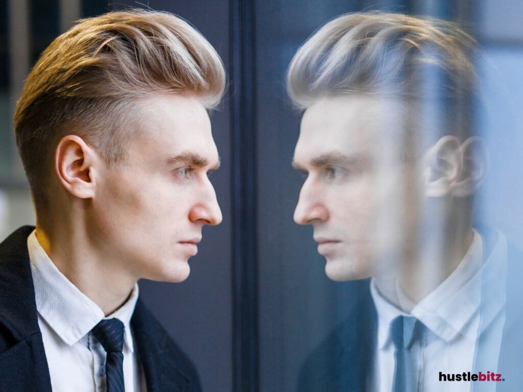 A man gazing into a reflective surface.