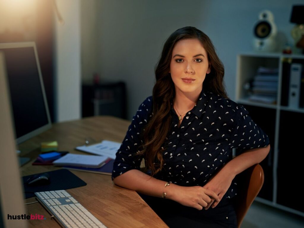 A woman looking at the camera inside the office