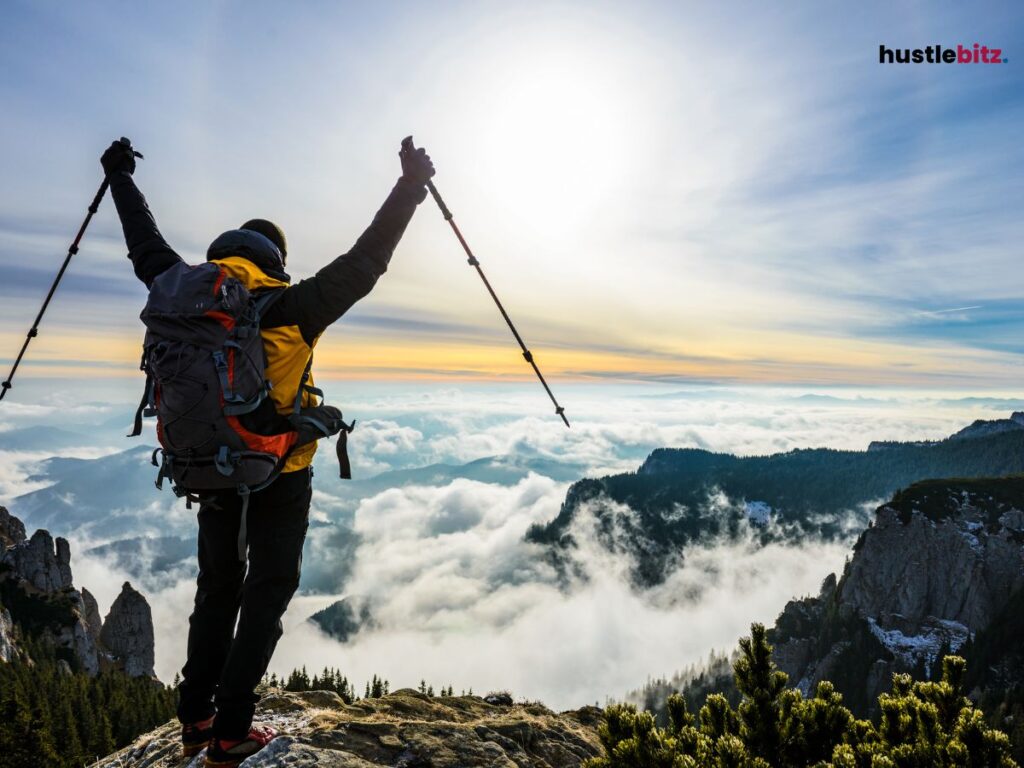 A man standing in front of the mountain