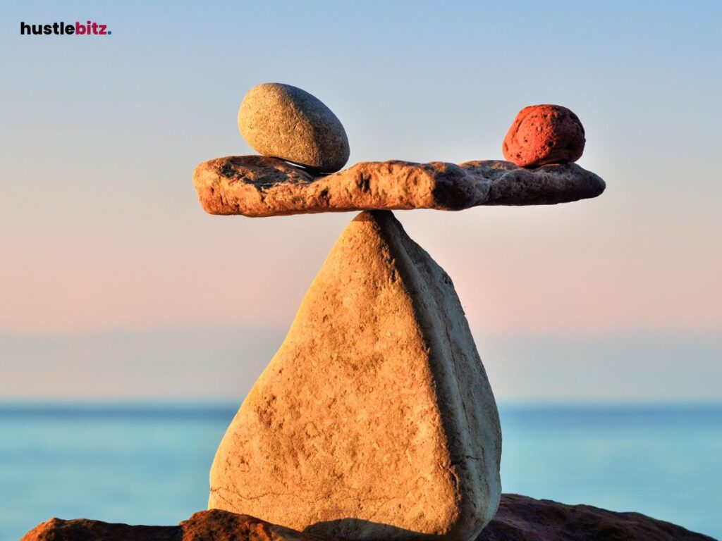 Two smallet rocks are being balanced in the larger one.