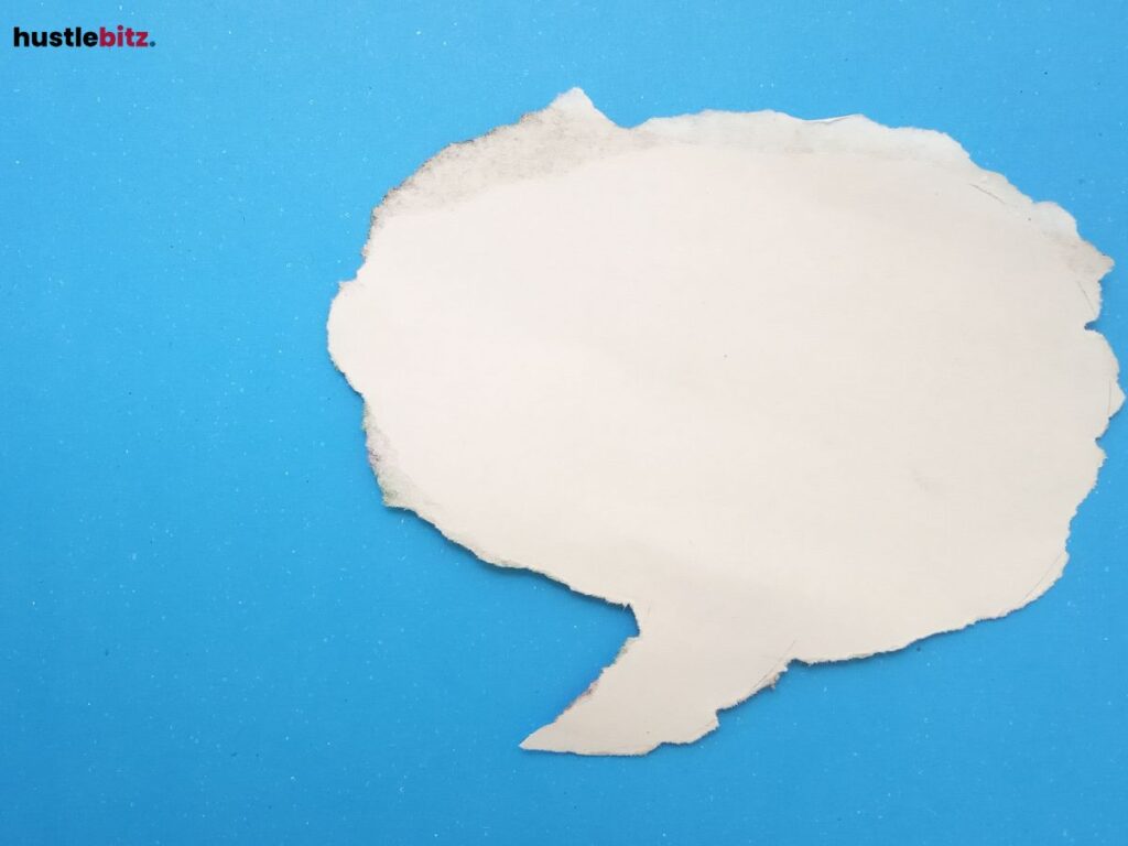 Torn paper shaped like a speech bubble on a blue background.