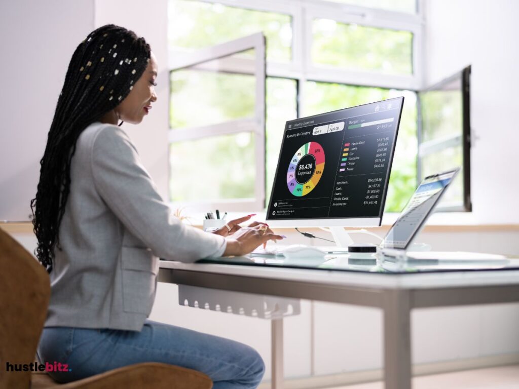 A woman facing the monitor with time tracking software