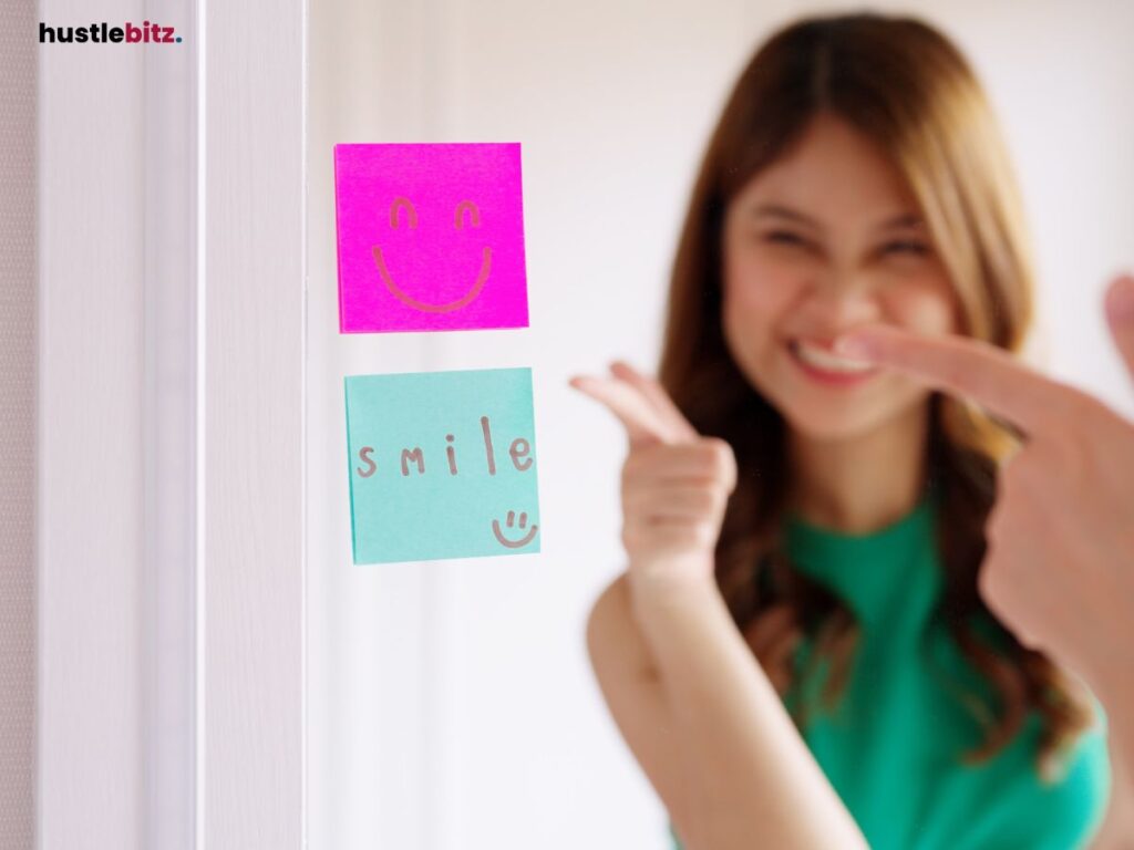 Woman pointing at sticky notes on a mirror, smiling and cheerful.