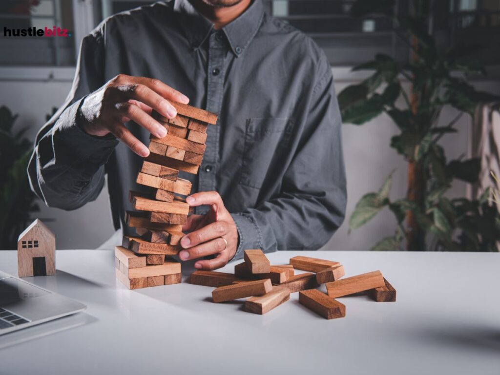 A man holding a Jenga blocks