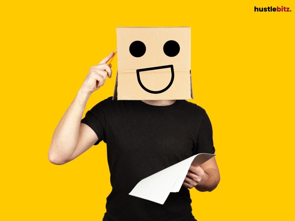 A person wearing a box with a happy face, pointing to their head with a cheerful expression