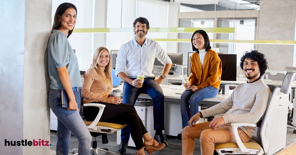 Group of people smiles inside the office