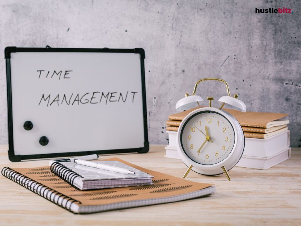 A clock, notebook, books and a mini white board