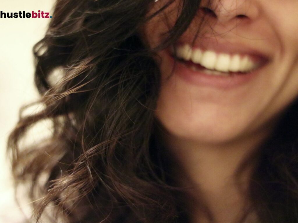 Close-up of a woman's smiling face.