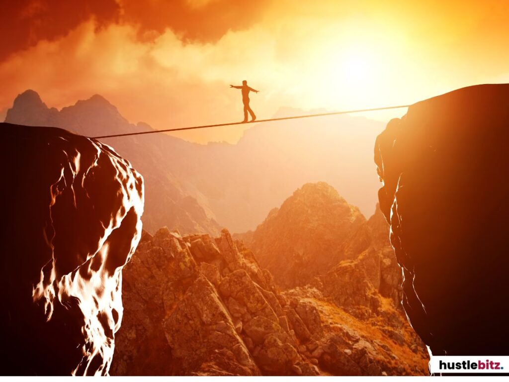 A person walking in the rope beside two rocks