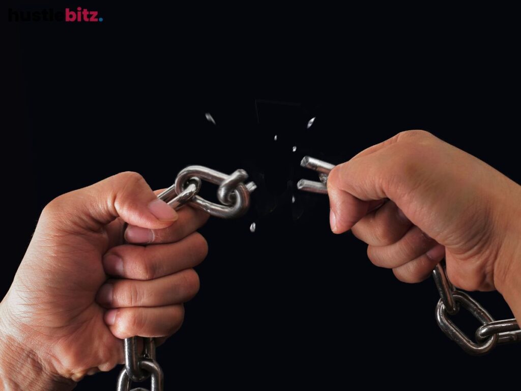two hand breaking the chain