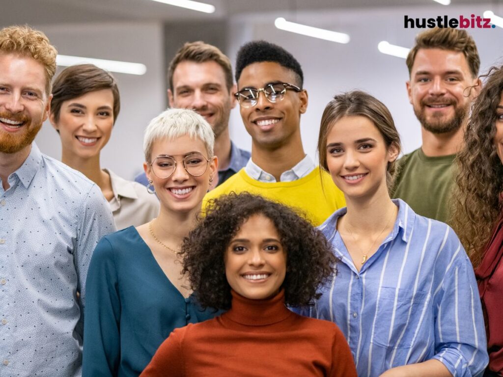 A diverse group of people smiling confidently, reflecting inclusiveness.