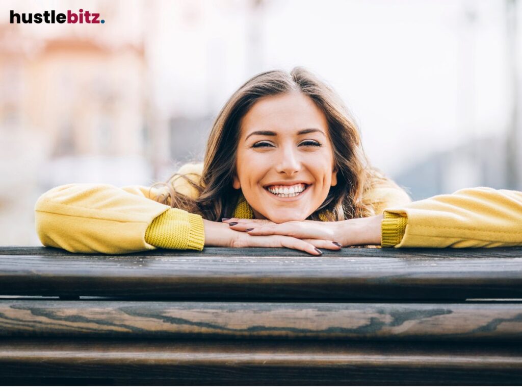 A woman looking at the camera and smiles